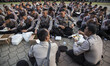 People gathered at Senayan-Jakarta celebrating the Independence day by playing roping and...