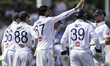 Shoaib Bashir of England is congratulated for taking the wicket of Tom Blundell of New Zea...
