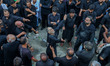 Kashmiri Shia Muslim mourners beat their chests during a religious procession on the tenth...