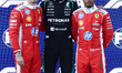 Charles Leclerc of Ferrari, George Russell of Mercedes and Lewis Hamilton of Ferrari after...