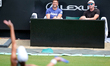 The team of second seed Madison Keys of the United States watches her in action during the...