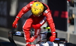 Lewis Hamilton of Scuderia Ferrari celebrates his third place during qualifying for the Au...