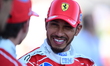 Lewis Hamilton of Scuderia Ferrari celebrates his third place during qualifying for the Au...