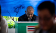 A voter casts a ballot during the election for the next Bangkok Governor and City Council...