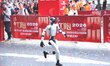 A robot participates in a running event on a racetrack on Bizhou Avenue in Tongjiang Count...