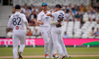 England captain Ben Stokes and Jofra Archer celebrate after Daryl Mitchell of New Zealand...
