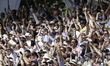 England supporters celebrate as Ben Stokes of England takes a wicket moments after his ret...