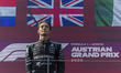 George Russell of Great Britain and Mercedes AMG Petronas F1 Team stands on the podium aft...