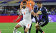 Giovani Lo Celso of Argentina and Noor Al Rawabdeh of Jordan compete during the Group J FI...