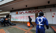 Demonstrators at a 'counter-pride protest' paint graffiti and damage storefronts during de...