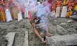 Nepalese kids from Hindu school Bhagwat Sanyaas Aashram Gurukul performing rituals offerin...
