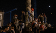 People participate in the Sao Joao festivities in Porto, Portugal, on June 23, 2026. The e...