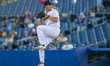 Alex Kranzler of the Trenton Thunder delivers a pitch during an MLB Draft League baseball...