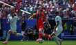 Jorgen Strand Larsen of Norway battles for possession with Maxence Lacroix of France durin...