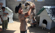 Displaced Palestinian children participate in psychological debriefing sessions at an art...