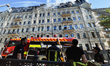 Rescuers work at the site of a hotel building damaged in a missile and drone strike in the...