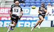 George Flanagan catches a pass during the BetFred Super League match between Huddersfield...