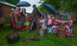 KRAKOW, POLAND - JULY 5: 
Festival participants and visitors use umbrellas to escape the...