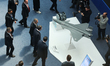 Turkish Vice President Cevdet Yilmaz looks on a model of Bayraktar drone during the Defenc...
