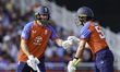 Phil Salt of England (left) is congratulated for scoring a half-century during the 3rd Vit...