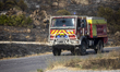 Firefighters work to contain a major wildfire near Trevillach, in the Pyrenees-Orientales...