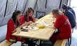 Medics and personnel of the State Emergency Service of Ukraine have lunch in a State Emerg...