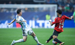 Lionel Messi of Argentina battles for possession with Marwan Attia of Egypt during the FIF...