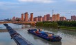 Ships carrying essential production materials such as coal and wood navigate the Huai'an s...