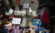 A woman arranges flower bouquets in the colors of Argentina in Buenos Aires, Argentina, on...