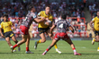 Alex Mellor is tackled during the BetFred Super League match between Leigh Leopards and Ca...