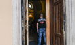 RZESZOW, POLAND - JULY 11: 
A man stands in the entrance doorway of a church during a sol...
