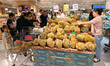Customers purchase imported durian at a JD-operated supermarket ''7FRESH'' in Shanghai, Ch...