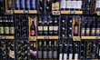 Bottles of Piccini Chianti Riserva, Santa Cristina, and Banfi wine are displayed on a shel...