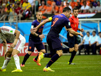 #9, Van Persie and #10, Sneijder, from Netherlands, and #16 Sergio Busquets, from Spain, in the #3 match of the 2014 World Cup, in Salvador,...