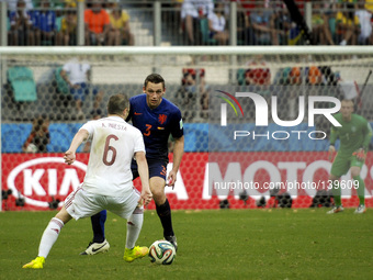 Andres Iniesta, from Spain, faces De Vrij, from Netherlands, both watched by Netherlands' goalkeeper Jasper Cillessenc at the 2014 World Cup...