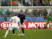 Andres Iniesta, from Spain, faces De Vrij, from Netherlands, both watched by Netherlands' goalkeeper Jasper Cillessenc at the 2014 World Cup...