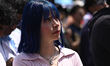A woman watches the FIFA World Cup 2026 semifinal match between Spain and France on a larg...
