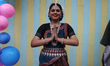 A Hindu devotee offers prayers before the chariot of Lord Jagannath during the annual Rath...