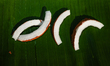 Selected coconuts are peeled with a sharp tool called a Coconut Breaker or Kattari or Dao...