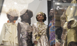 Models as seen through a glass window  during the King's of Couture Luxury Fashion Fundrai...