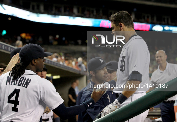 Detroit Tigers second baseman Ian Kinsler (3) is congratulated by center fielder Cameron Maybin (4) after his two-run home run in the fifth...
