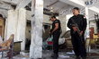 Security officials examine the blast site in northwest Pakistan's Mardan, Sept. 2, 2016. A...
