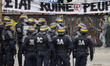 French riot police stand guard during a demonstration against the controversial labour ref...