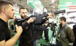 A visitor tests a gun during "Arms and Security 2016" exhibition in Kiev, Ukraine,11 Octob...