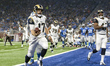 Los Angeles Rams quarterback Case Keenum (17) scores a touchdown during the first half of...
