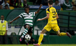 Sporting's forward Gelson Martins (L) vies for the ball with Dortmund's midfielder Julian...