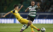 Dortmund's midfielder Julian Weigl (L) vies for the ball with Sporting's forward Bruno Ces...