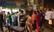 Indian people waiting in a queue at the bank’s  ATM counters in Kolkata , India on Tuesday...