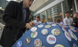 Hillary Clinton supporters purchasing buttons near Jacob K. Javits Convention Center in Ne...