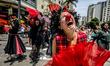 Clowns make a grumpy protest against the austerity package of the Temer government, in Sao...